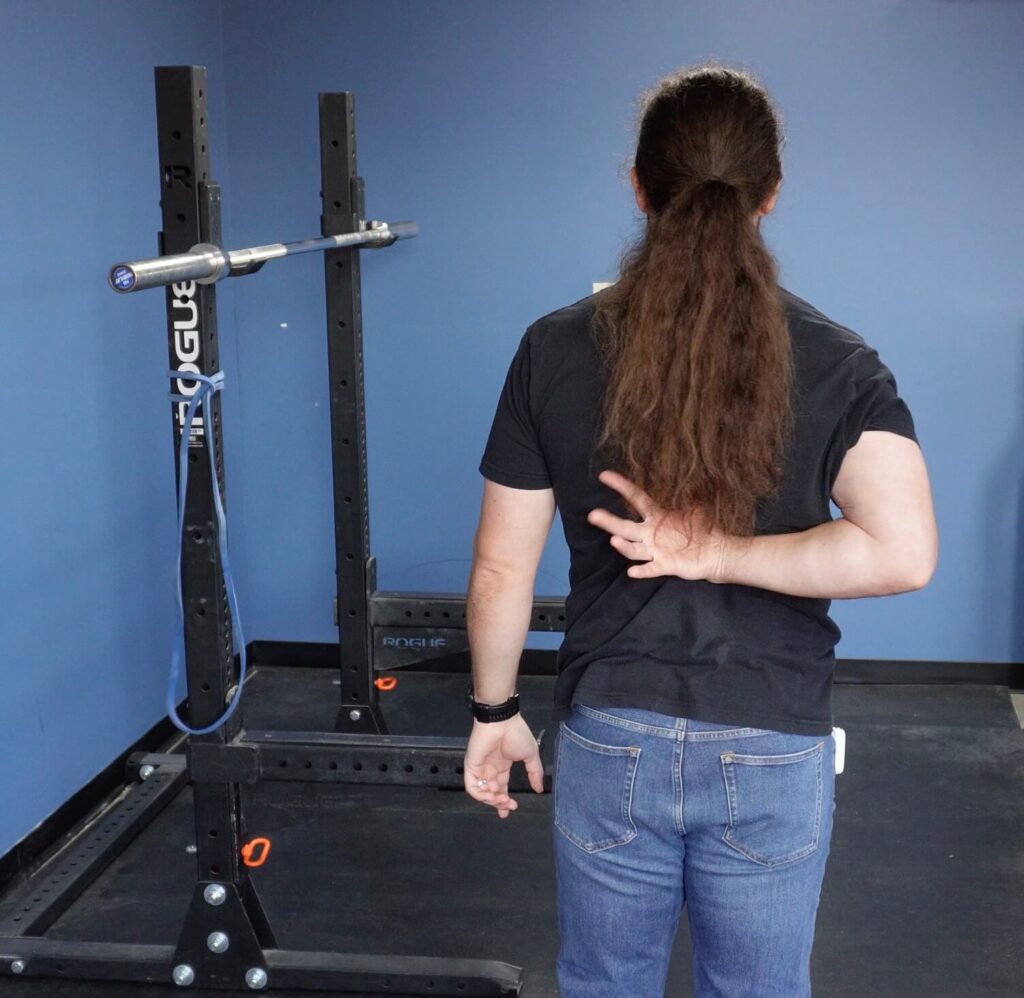 Test by reaching your arm behind your back before doing your shoulder mobility exercises